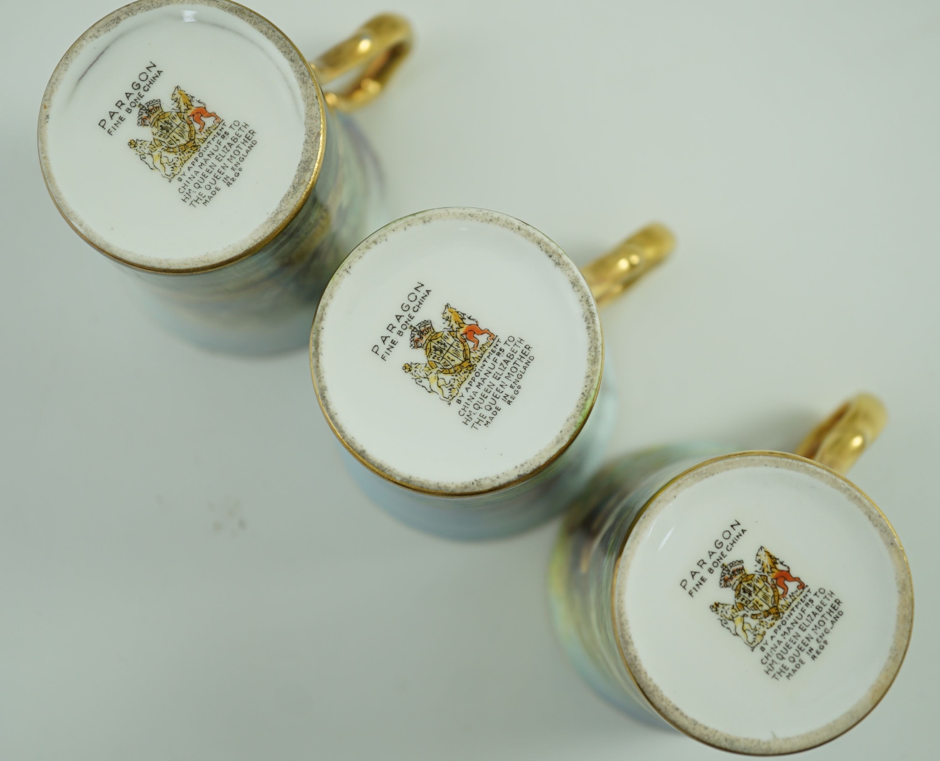 A set of six Paragon bird painted cabinet cups and saucers, 1950s, Saucers 11 cm diameter